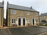 A photo from a recently completed BBS project, titled 'Natural Stone Walling for New Homes in North Yorkshire'