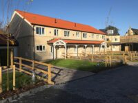A photo from a recently completed BBS project, titled 'BBS supplies Walling & String Course for Exclusive Housing Development near Leeds'