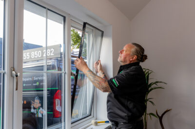 A photo of a Window Doctor engineer replacing a glass unit